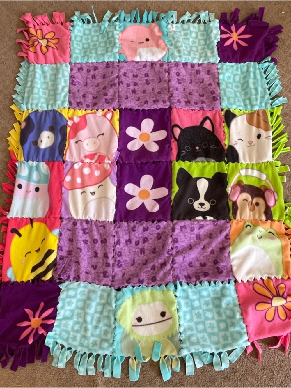 Squishmallow Patchwork Fleece Throw Blanket in Purple, Teal, Pink, Green